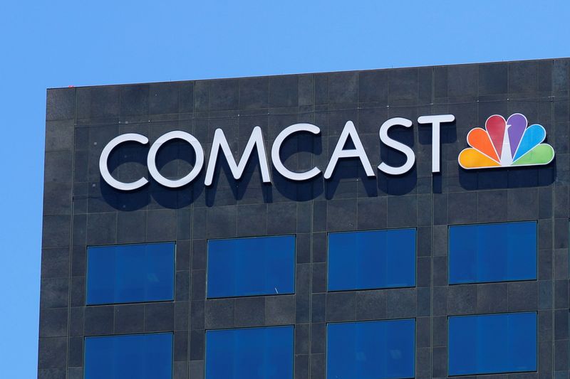 Comcast to proceed with plans to spin off its cable channels, sources say