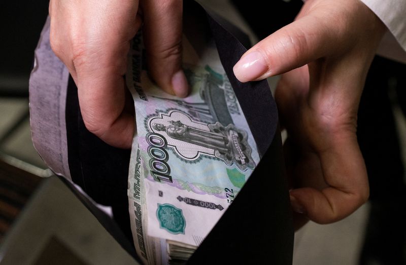 Russian central bank intervenes as rouble tumbles past 110 to the dollar