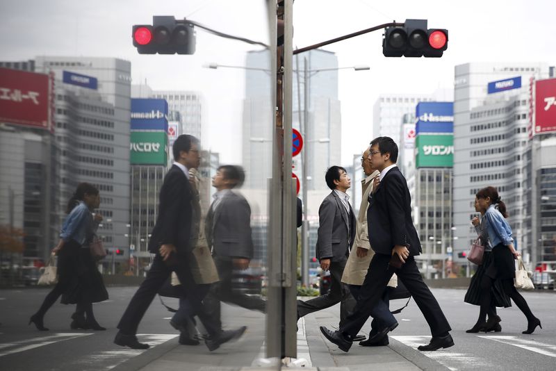 BOJ sees widening wage hikes, signals chance of near-term rate hike